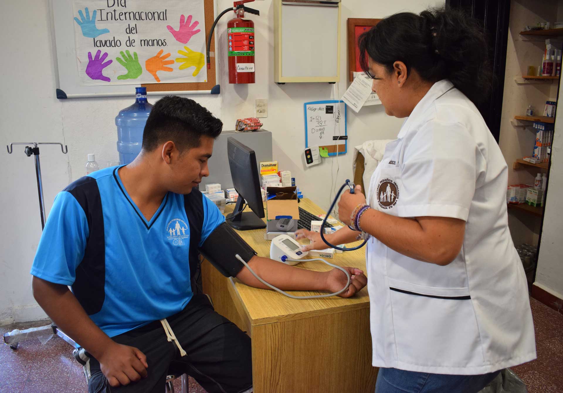 NPH Provides Protection to Children in Latin America | Young man getting his blood pressure measured.
