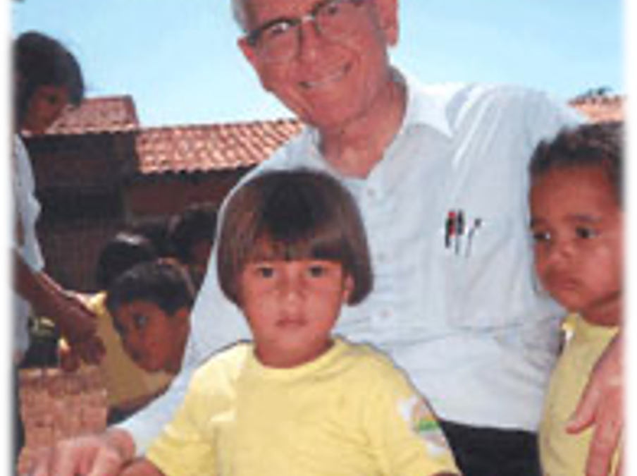 Father Wasson with two children